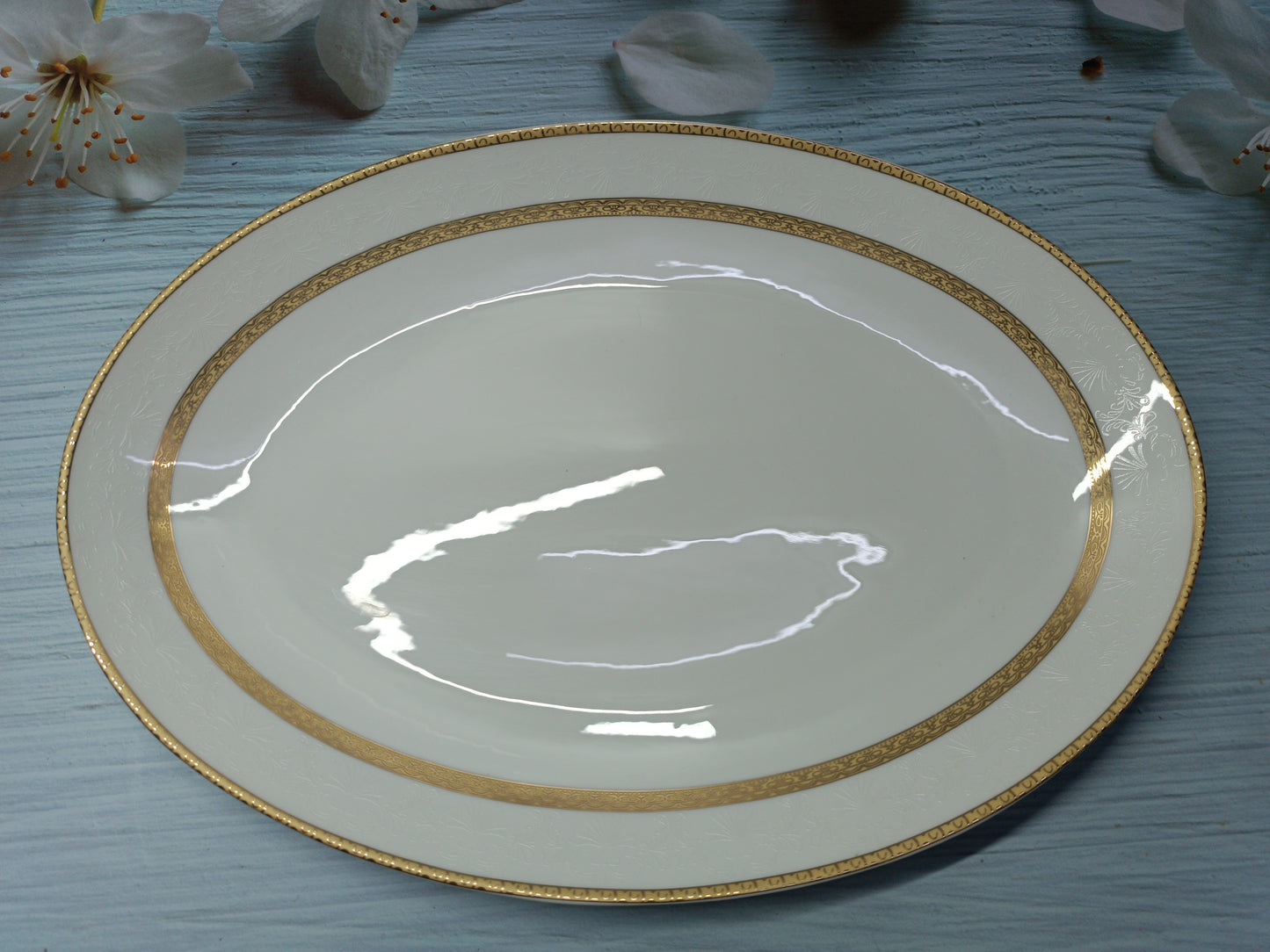 Elegant rice plate in fine china with intricate golden and silver detailing, perfect for sophisticated dining and special occasions.